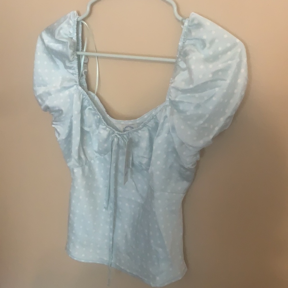 Blue shirt with white polka dots